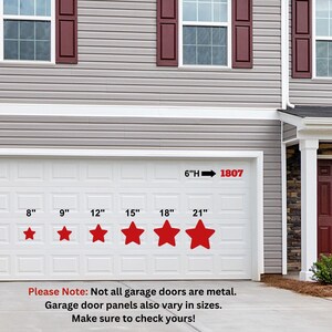 May include: A white garage door with a red 6"H 1807 sign above it. The door has five red stars with numbers 8", 9", 12", 15", 18", and 21" underneath them. The text "Please Note: Not all garage doors are metal. Garage door panels also vary in sizes. Make sure to check yours!" is below the door.