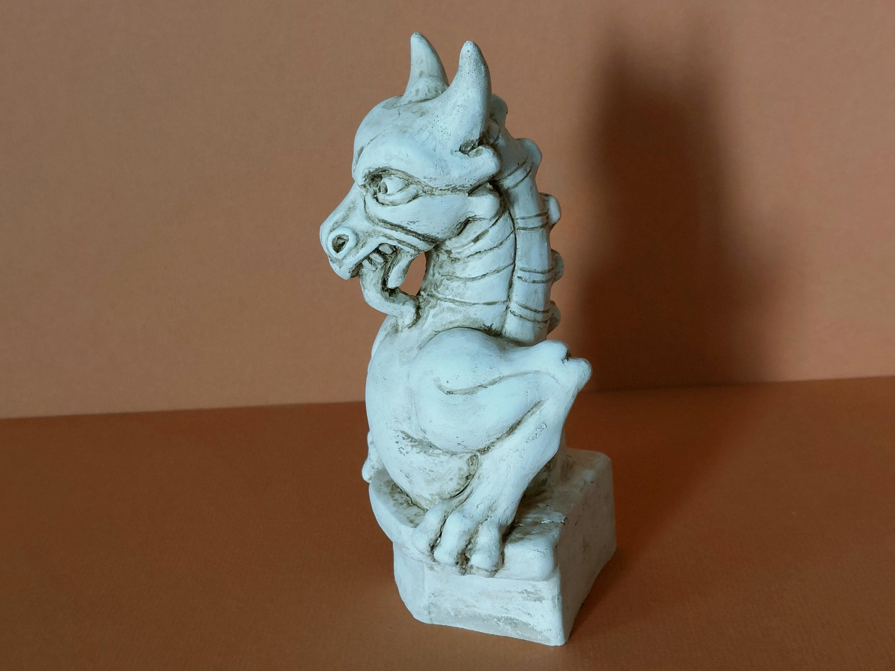 Terragon the chimera - figurine inspired by a chimera in the tower of St Mary's parish church in Woburn, England