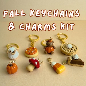 May include: A collection of fall-themed keychains and charms featuring a white ghost, a frosted cookie, a bear in a pumpkin, a lattice pie, a small pumpkin, a red mushroom, candy corn, and a slice of chocolate pie with text FALL KEYCHAINS & CHARMS KIT.
