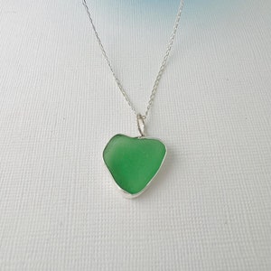 Cornish seaglass  heart of green set in an open bezel of recycled fine silver,  shaped only by the waves of the Cornish Isles of Scilly