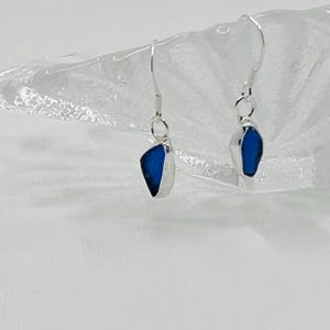 Deep cobalt blue  sea glass earrings set into a open bezel setting of recycled fine silver,collected from my favourite beach in Cornwall UK
