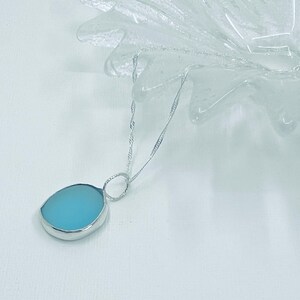 Large of turquoise blue seaglass handset in eco silver bezel setting to enhance its unique colour, amazing turquoise blue large seaglass gem