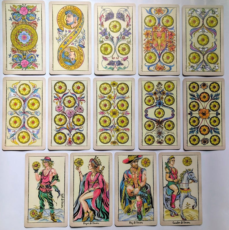 May include: A collection of fourteen tarot cards featuring intricate illustrations of coins, floral patterns, and figures. The cards display various arrangements of yellow circular coins, ornate botanical designs, and four human figures in colorful attire.
