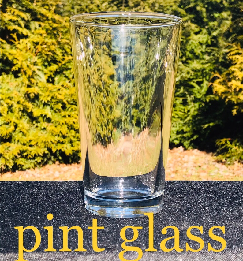 May include: A clear glass pint glass, perfect for serving beer or other beverages.
