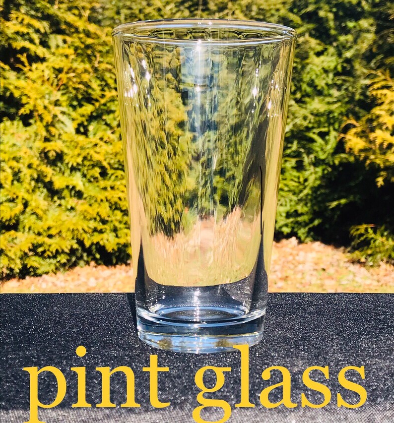 May include: A clear glass pint glass, perfect for serving beer or other beverages.