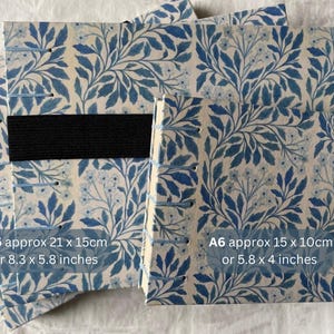 Floral watercolour sketchbook. Coptic binding with 300gsm cold pressed paper. Front view of A5  and A6 landscape books with size details. A5 approx 21 x 15cm or 8.3 x 5.8 inches. And A6 approx 15 x10cm or 5.8 x 4 inches.