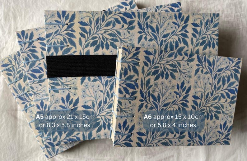 Floral watercolour sketchbook. Coptic binding with 300gsm cold pressed paper. Front view of A5  and A6 landscape books with size details. A5 approx 21 x 15cm or 8.3 x 5.8 inches. And A6 approx 15 x10cm or 5.8 x 4 inches.