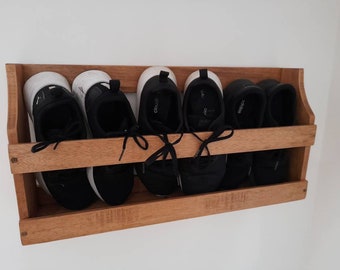 Handmade rustic wall mounted wooden shoe rack tidy. Made from reclaimed wood and upcycled to offer handy shoe storage. Great in any home.