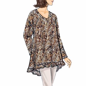 May include: A long-sleeved, animal print top with a ruffled hem. The top has a V-neck and is a loose fit.