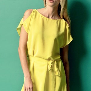 May include: A bright yellow sleeveless top with a tie belt. The top has a scoop neck and cold shoulder cutouts.