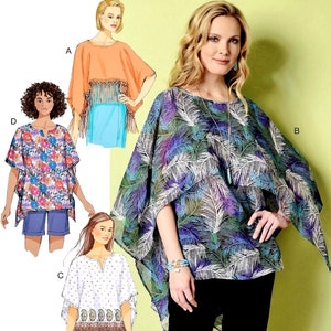 May include: Butterick B6356 sewing pattern featuring four different poncho-style tops. The tops include a fringed orange poncho, a floral print poncho, a white poncho with a patterned border, and a blue and purple feather print poncho.