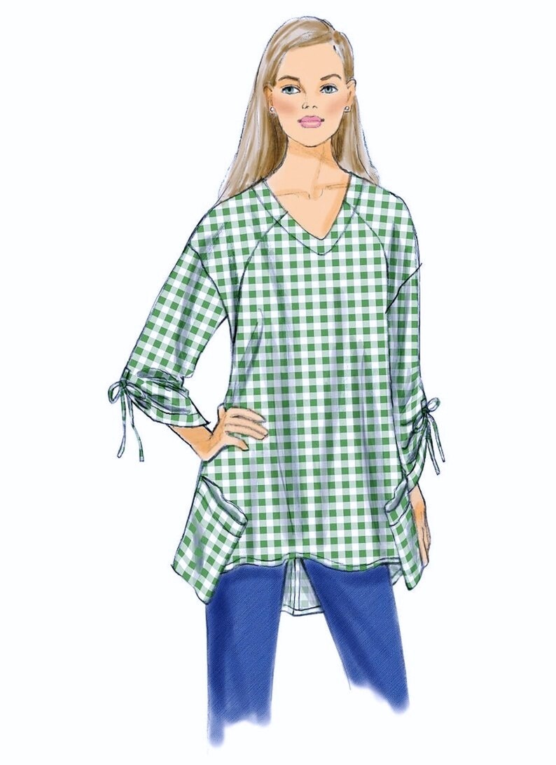 May include: A green and white gingham top with a v-neck, long sleeves, and tie details at the cuffs. The top has two patch pockets on the front and a slightly longer back hem.