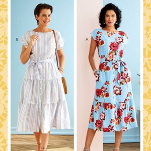 May include: Two women's dresses, one with a striped pattern and the other with a floral pattern. Both dresses have a button-up front, a tie belt, and a tiered skirt. The dresses are shown on models against a light blue background. The pattern number B6722 and size A5 (6-8-10-12-14) are printed on the image.