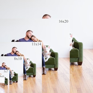 May include: A couple and their dog are sitting on a green velvet couch. The couple is cuddling and the dog is sitting on the couch with them. The photo is taken in a white room with a brick wall in the background.