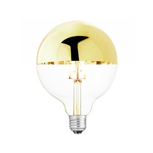 May include: A gold-plated light bulb with a clear glass bottom. The bulb has a standard screw-in base.