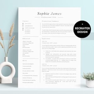 May include: A white ceramic mug with a black handle and the text "But First, Coffee" in a black, handwritten-style font. The mug is on a white surface.