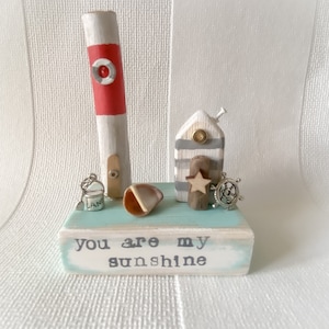 Miniature beach hut on reclaimed wood. ‘You are my sunshine’. Thinking of you gift