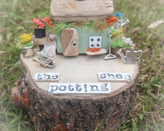miniature houses.  ‘The potting shed’. Driftwood art.