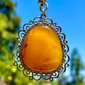 Vintage Baltic Egg Yolk Amber Pendant on a Chain | Yellow Amber Pendant in a Filigree Silver Tone Setting | Vintage Baltic Amber Jewelry