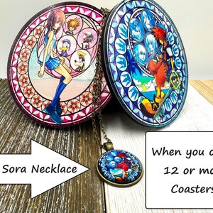 May include: Two round coasters featuring stained glass designs from the Kingdom Hearts video game series. The coaster on the left features Kairi, Donald Duck, and Goofy. The coaster on the right features Sora, Riku, and Mickey Mouse. A free Sora necklace is included when you order 12 or more coasters.