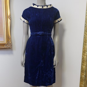 1930’s to 1940’s crushed velvet vintage dress. Royal blue with gold thread and fabric covered buttons and original belt. Fits a modern Small.