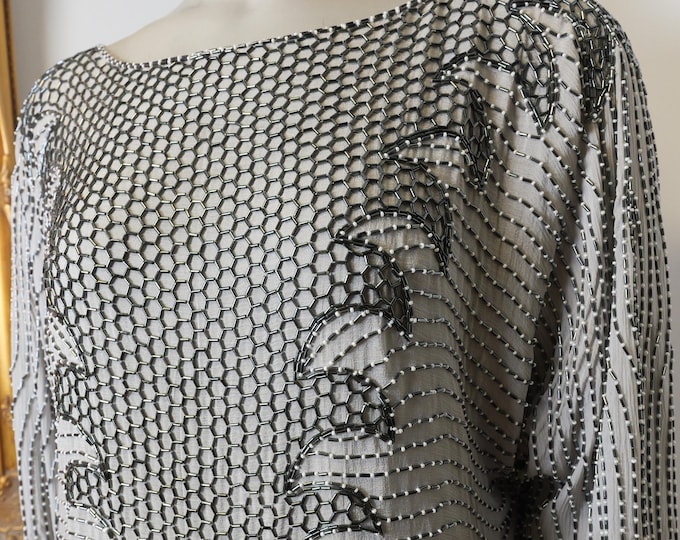 Vintage women’s heavily beaded silk blouse from the 1960’s