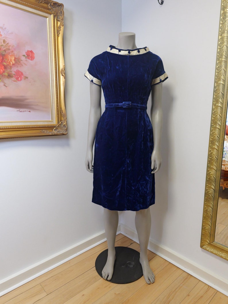 1930’s to 1940’s crushed velvet vintage dress. Royal blue with gold thread and fabric covered buttons and original belt. Fits a modern Small.