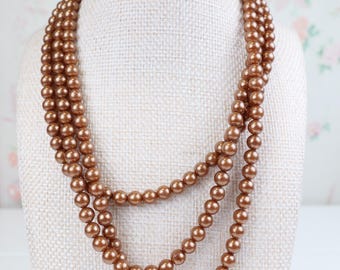Vintage women’s three strand faux Champaign pearl necklace with pretty sterling silver box clasp