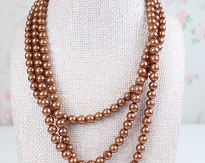 Vintage women’s three strand faux Champaign pearl necklace with pretty sterling silver box clasp