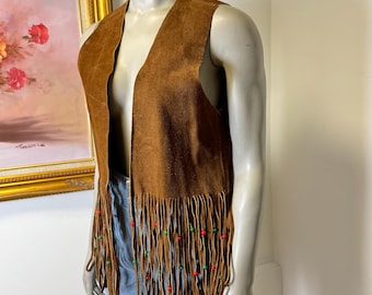 Vintage 1970's leather hippie vest with fringe and beads