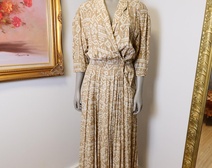 Vintage women’s 1980’s geometric wrap dress with pockets and deep V neckline size medium