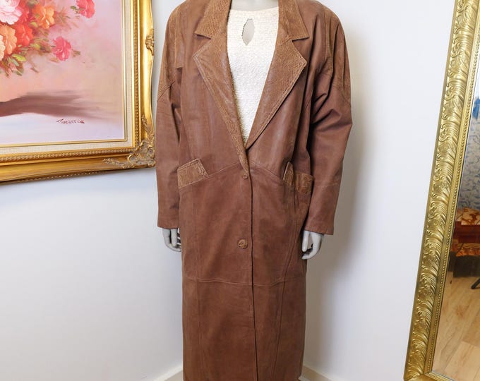 Women’s long brown leather trench coat size medium vintage from the 1980’s