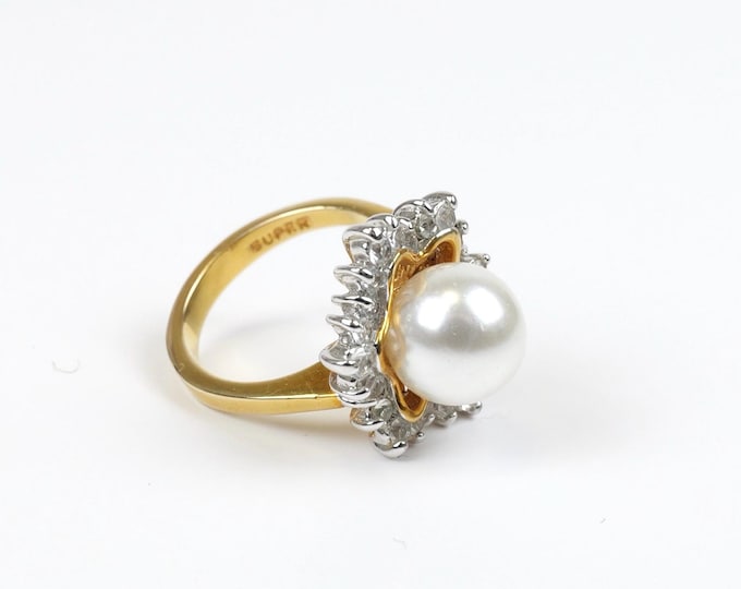 Vintage women’s pearl ring with gold band and CZ stone snowflake design