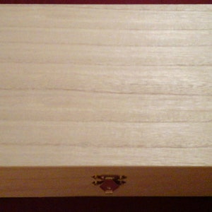 Wooden box with metal clasps