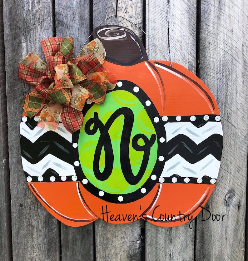 Whimsical personalized pumpkin door hanger