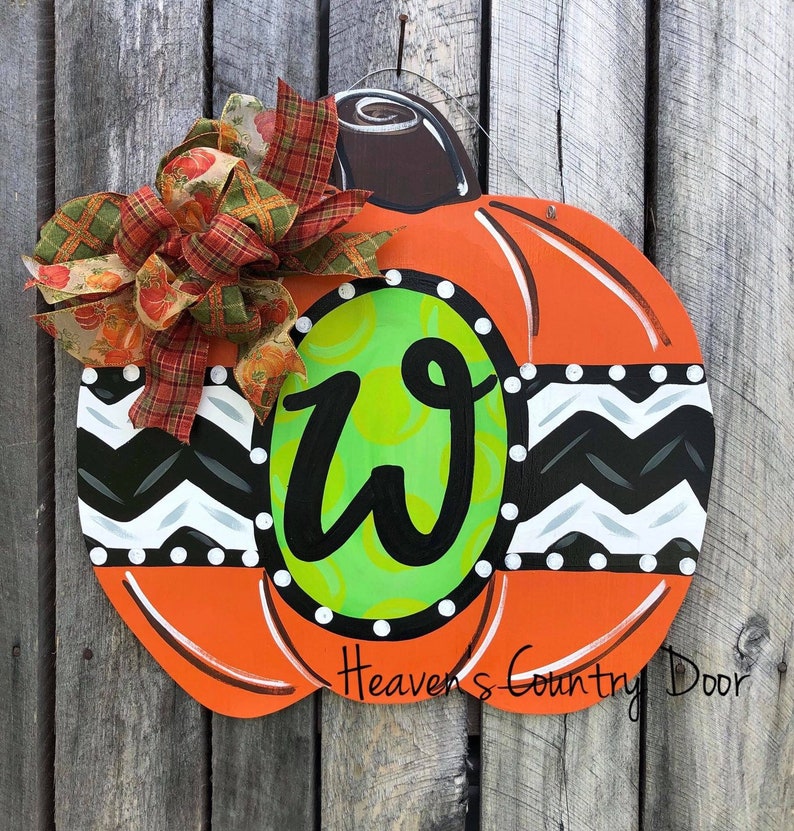 Whimsical personalized pumpkin door hanger