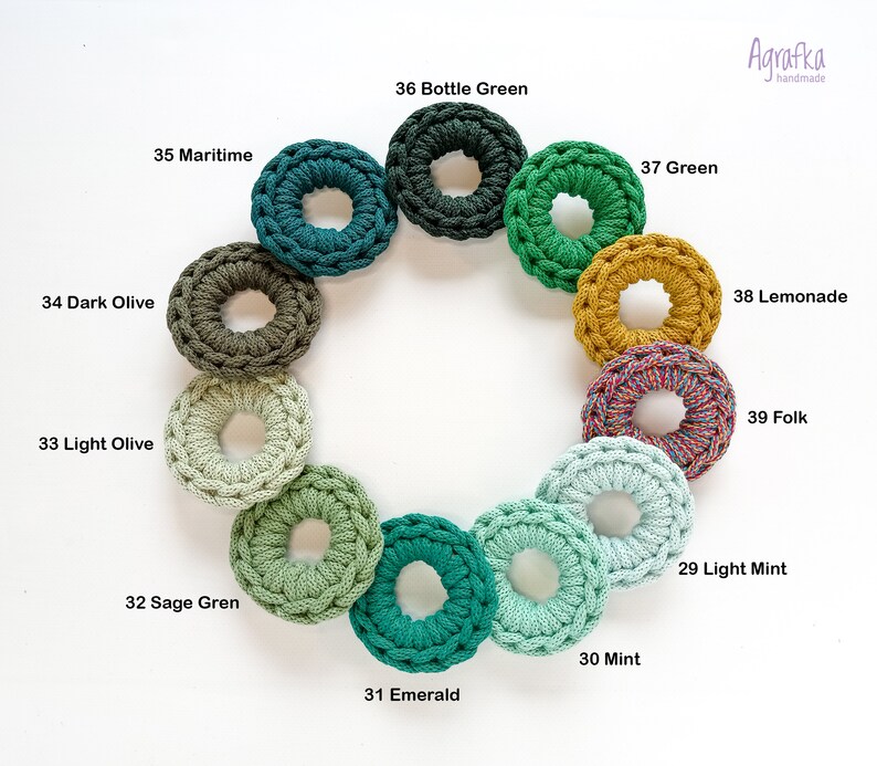 May include: A color chart of 12 crocheted rings in shades of green, yellow, and blue. The rings are arranged in a circle and labeled with their corresponding color names.