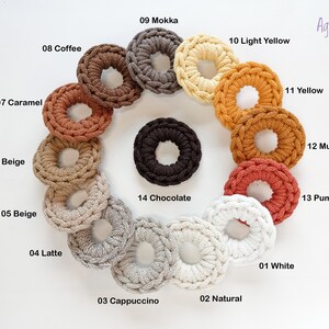 May include: A variety of crocheted rings in different colors, including white, natural, cappuccino, latte, beige, dark beige, caramel, coffee, mokka, light yellow, yellow, mustard, pumpkin, and chocolate.