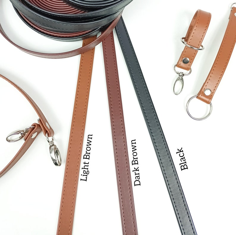 May include: Three leather straps in light brown, dark brown, and black. Each strap has stitching along the edges. The straps are laid out on a white surface. The text "Light Brown", "Dark Brown", and "Black" is written below each strap.