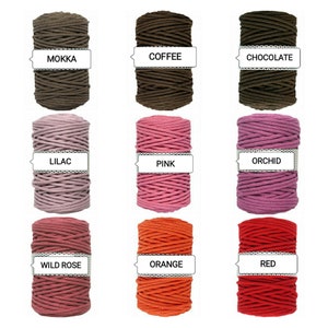 May include: Nine spools of cotton cord in various colors, including mocha, coffee, chocolate, lilac, pink, orchid, wild rose, orange, and red. Each spool has a label with the color name.