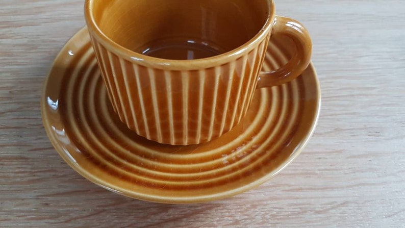 Set of 2 attractive Midcentury ceramic cup and saucers in a light brow-ocher colour glazing.