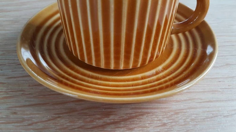 Set of 2 attractive Midcentury ceramic cup and saucers in a light brow-ocher colour glazing.