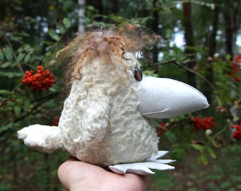 White fur crow with white beak and paws, interior toy