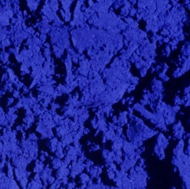 May include: Close-up of a blue powder with a grainy texture.