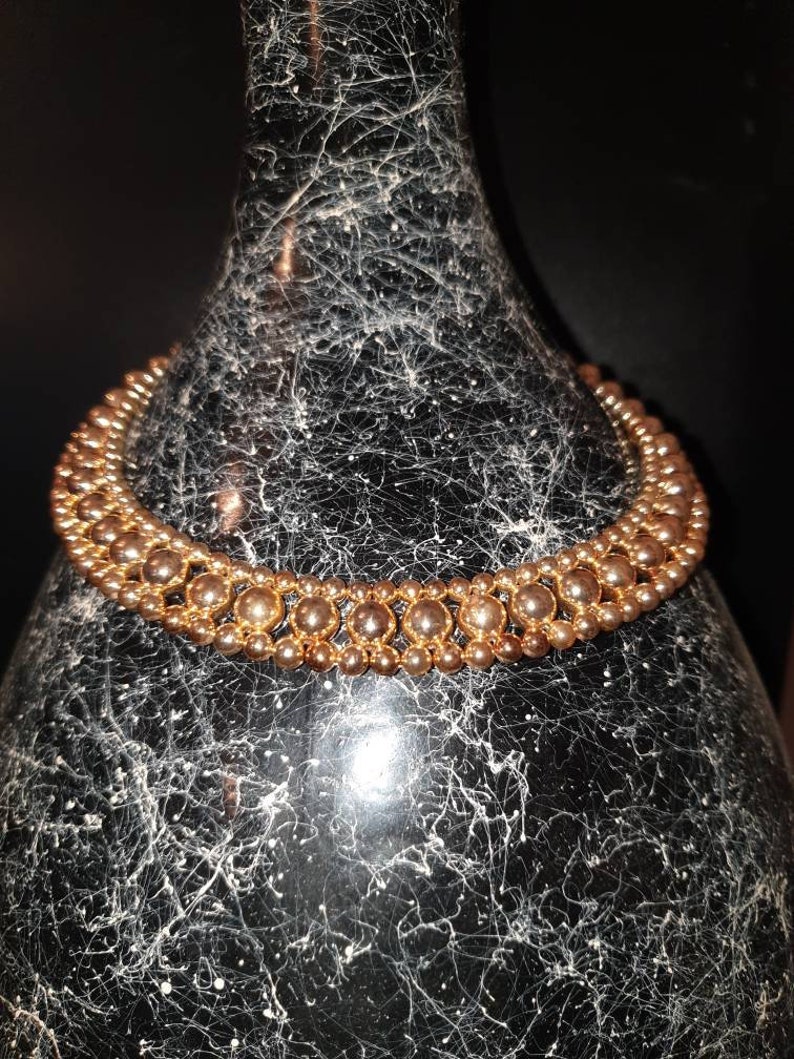 Vintage 1950s gold tone lucite beadsbeaded necklace.