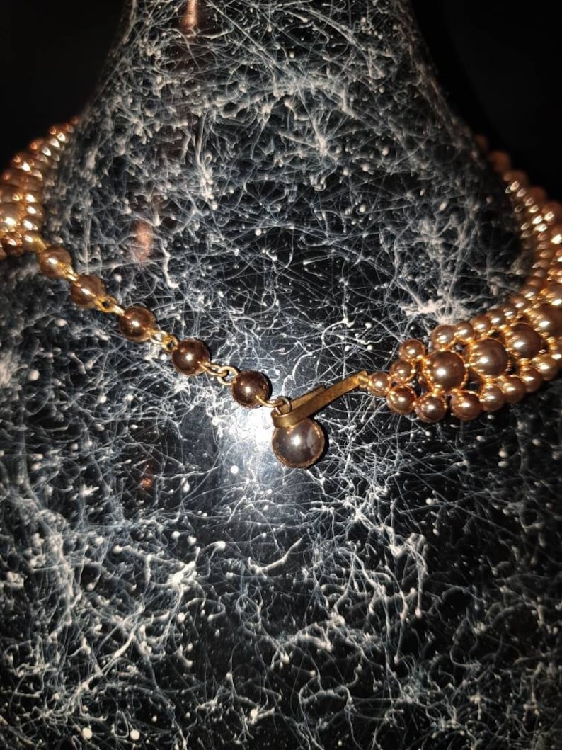 Vintage 1950s gold tone lucite beadsbeaded necklace.