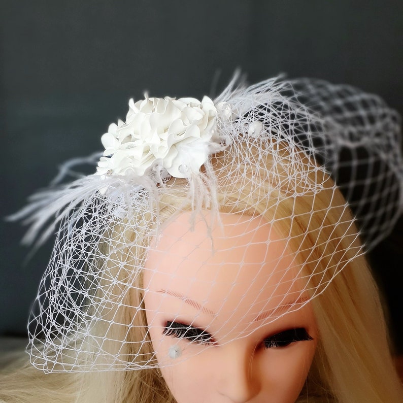 White birdcage veil with flower and feathers Etsy