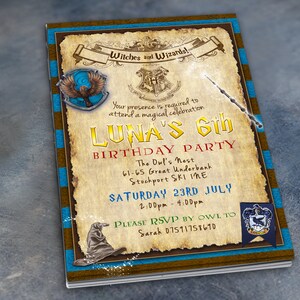 May include: A vintage-style invitation to a 6th birthday party with a Harry Potter theme. The invitation features a brown parchment background with blue and gold accents. The text reads "Witches and Wizards!" and "Luna's 6th Birthday Party". The invitation also includes images of the Hogwarts crest, a golden snitch, and a wand.