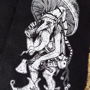 May include: Black and white illustration of a creature wearing a mushroom hat and holding a mug. The creature has a long, pointed nose and large, round eyes. The creature is wearing a long, flowing robe and has a long, flowing beard. The creature is standing on a platform with a small, round object on it.