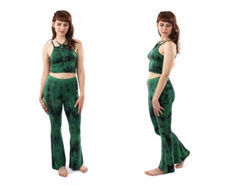 May include: A green tie-dye crop top and matching flared pants. The top has a halter neckline and the pants have a wide leg.